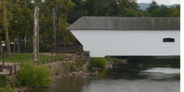 Covered Bridge Park, in downtown Elizabethton, Tennessee, is named for the historic covered bridge that spans the Doe River. The 2.25-acre park includes a small fountain, two pavilions, a gazebo, picnic tables and a large multiuse stage. Photo courtesy of IDEXlab